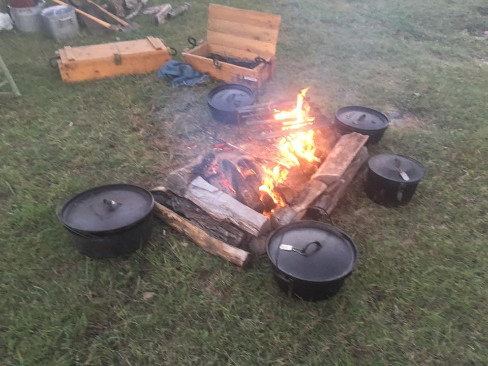 Scouts learning outdoor cooking skills