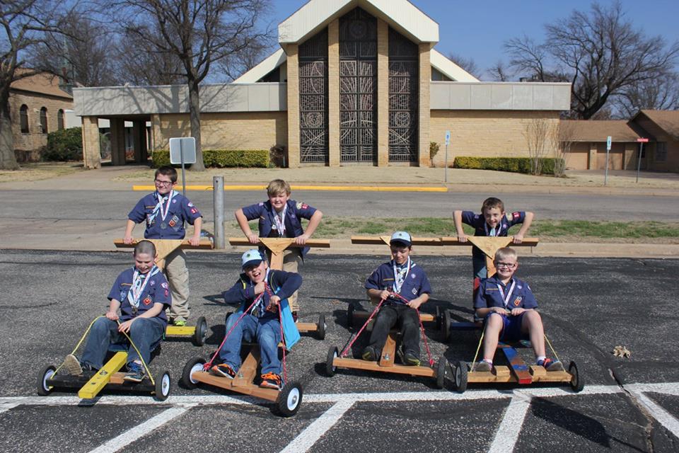 Cub Scouts racing push carts