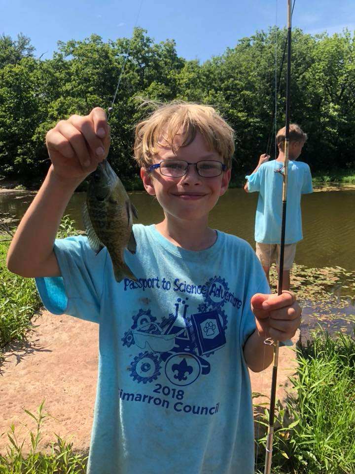 Scouts fishing at a lake