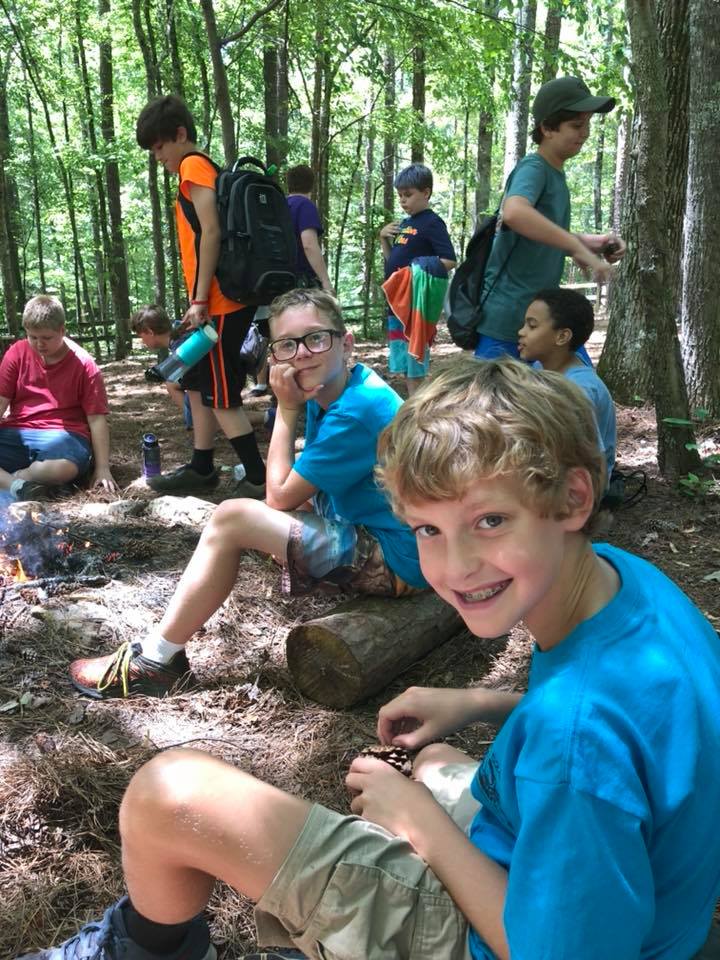 Scouts camping in tents outdoors